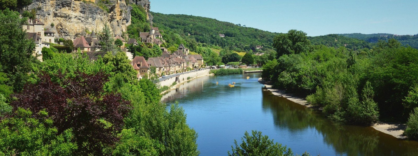 The limestone bluff seen along the river, town on top